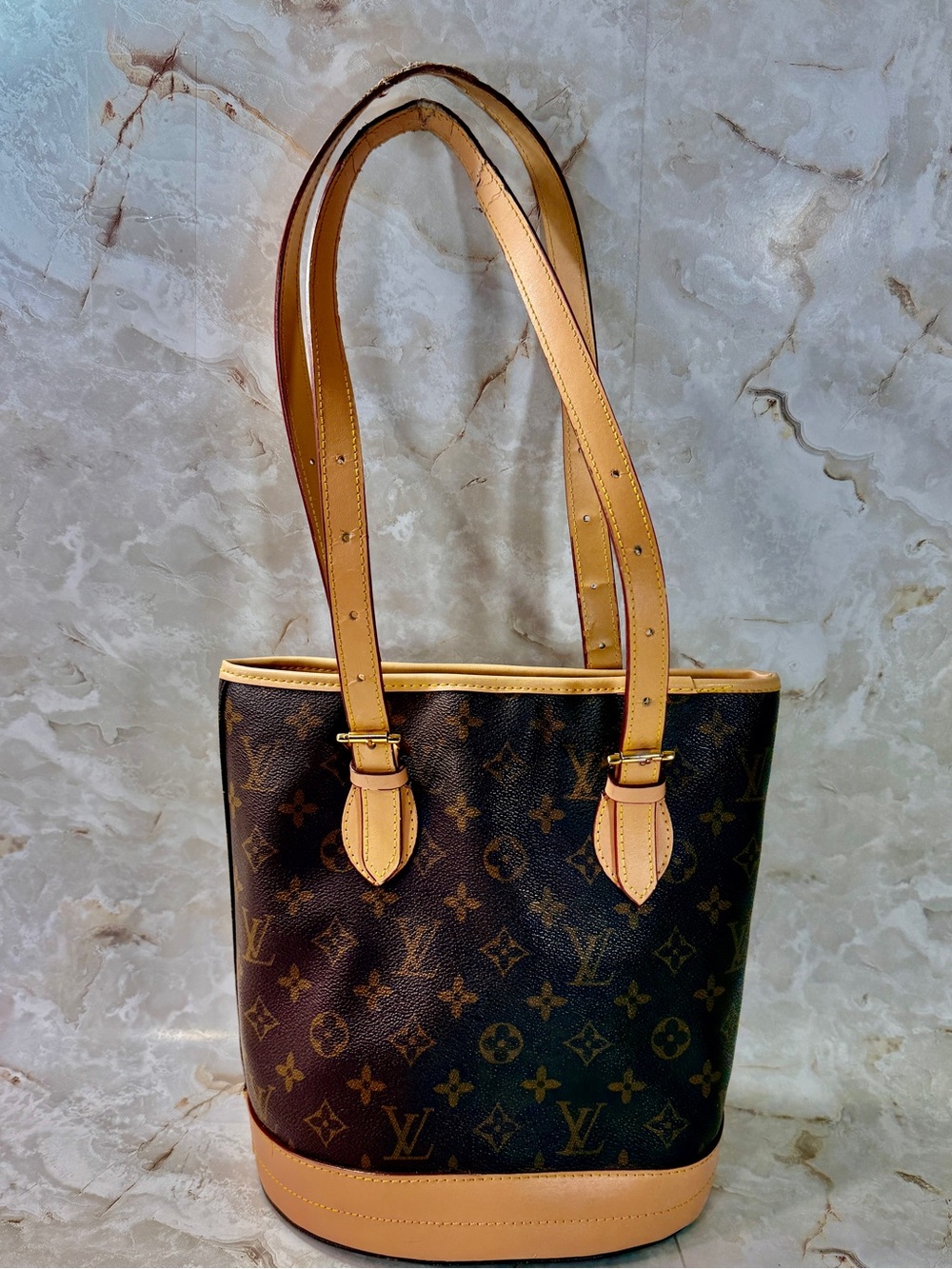 The Louis Vuitton Monogram Bucket PM Shoulder Bag Purse M42238